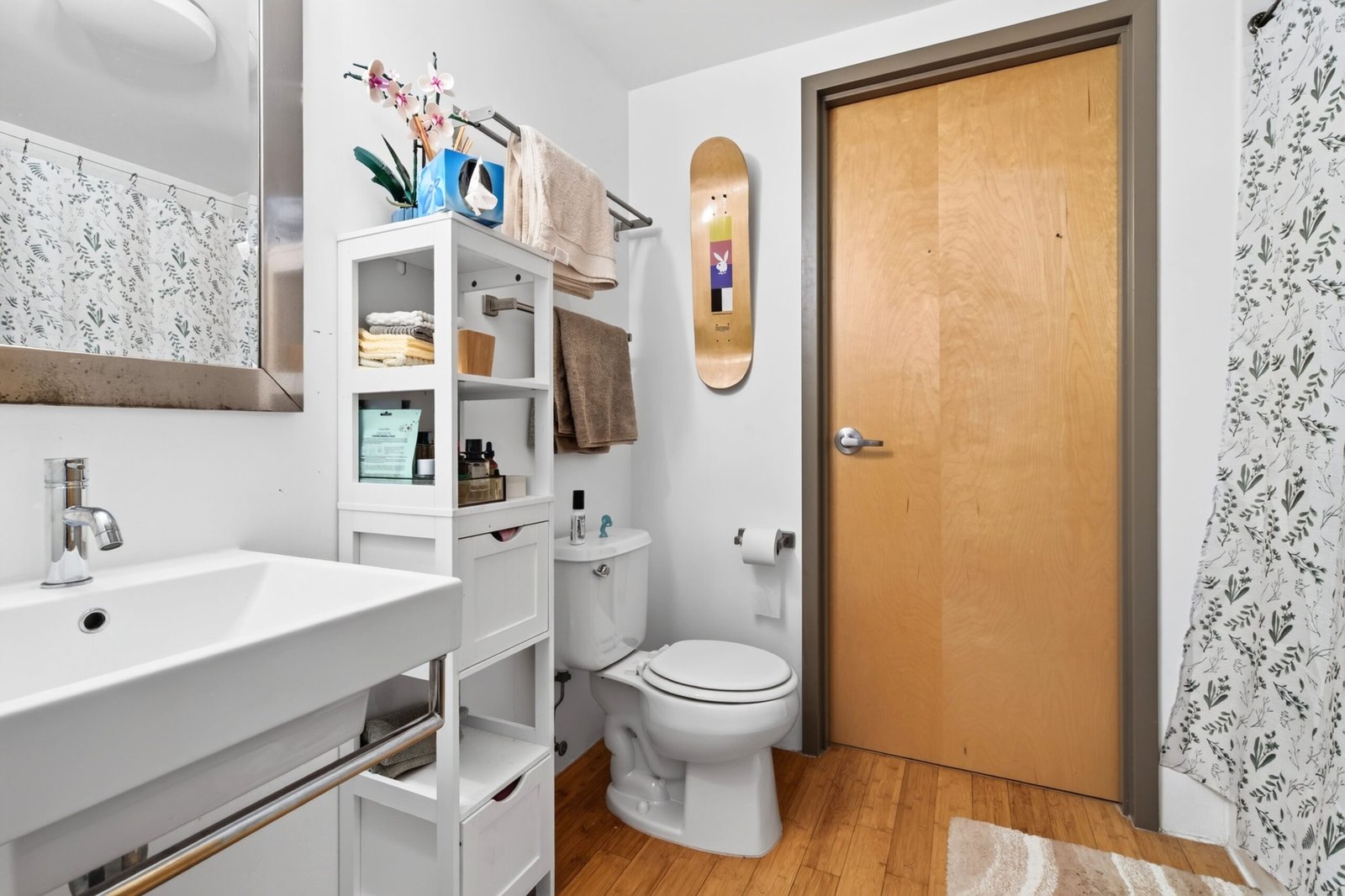 small bathroom with toilet, sink and tub showing limited floor space