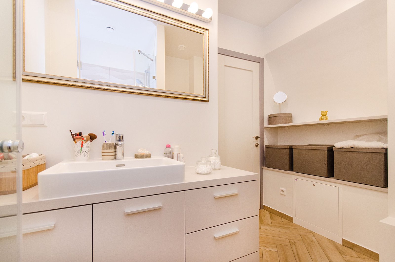open bathroom vanity showing the P-trap and the uneven space either side