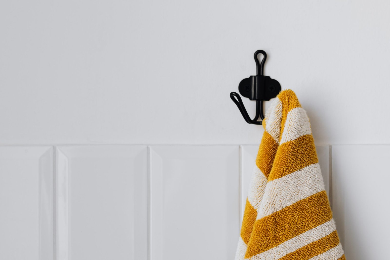 adhesive wall hook on a painted wall
